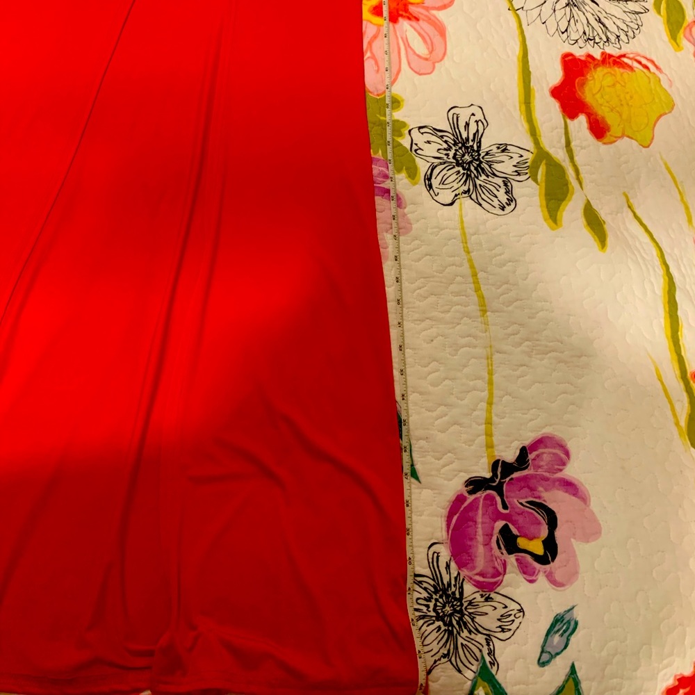 Red long sleeve duster top w/ long split in front.